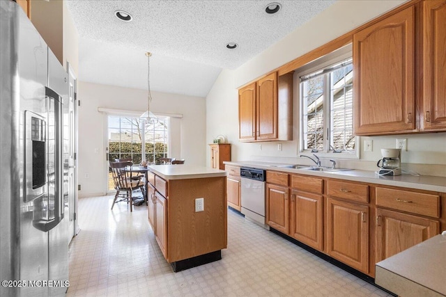 kitchen with light floors, stainless steel fridge with ice dispenser, a sink, a kitchen island, and dishwashing machine