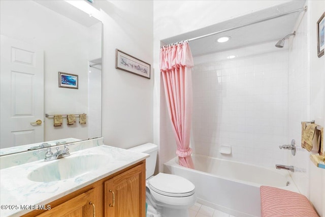 bathroom with vanity, shower / bath combo with shower curtain, toilet, and tile patterned floors