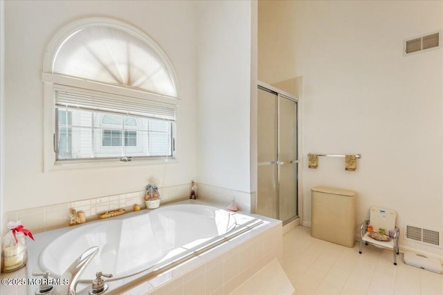 full bathroom with a stall shower, visible vents, and a garden tub