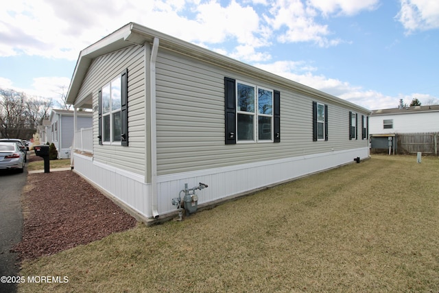 view of home's exterior featuring a yard