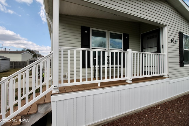 view of side of property with a porch