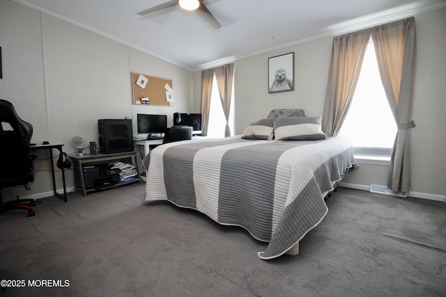 carpeted bedroom with crown molding, baseboards, lofted ceiling, and ceiling fan