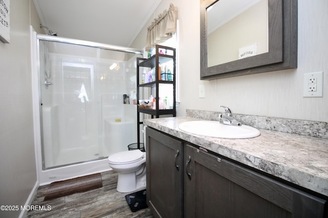 full bathroom with vanity, toilet, wood finished floors, and a shower stall