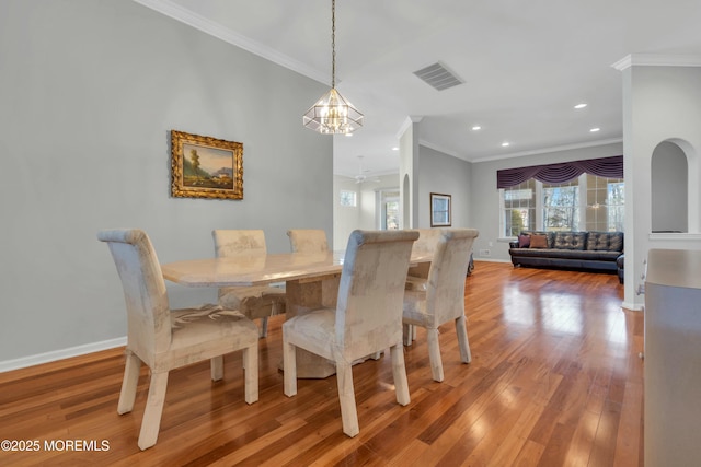 dining space featuring visible vents, baseboards, and wood-type flooring