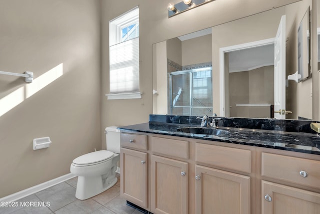 full bath featuring vanity, baseboards, a stall shower, tile patterned floors, and toilet