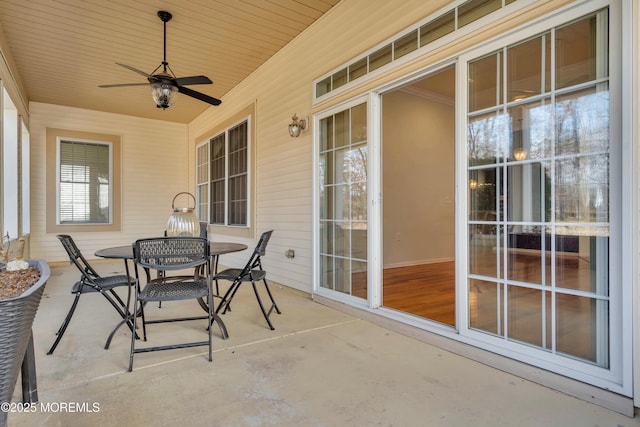 view of patio featuring outdoor dining space and a ceiling fan