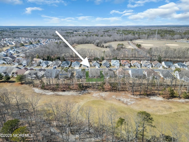 birds eye view of property with a residential view