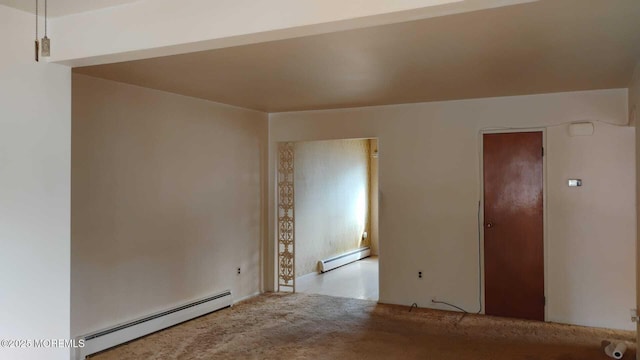 unfurnished room with carpet floors, a baseboard radiator, and baseboard heating