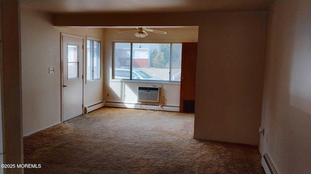 carpeted empty room with a baseboard radiator, an AC wall unit, and ceiling fan