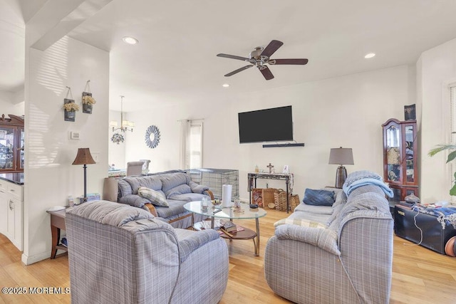 living room with light wood finished floors, a wealth of natural light, and recessed lighting