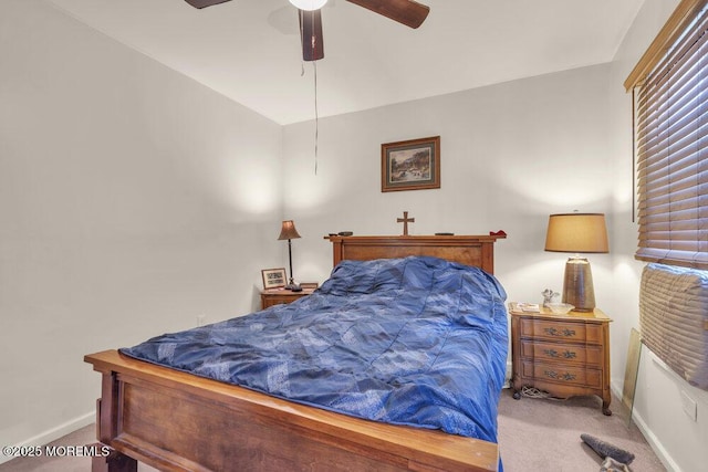 bedroom featuring ceiling fan, carpet flooring, and baseboards