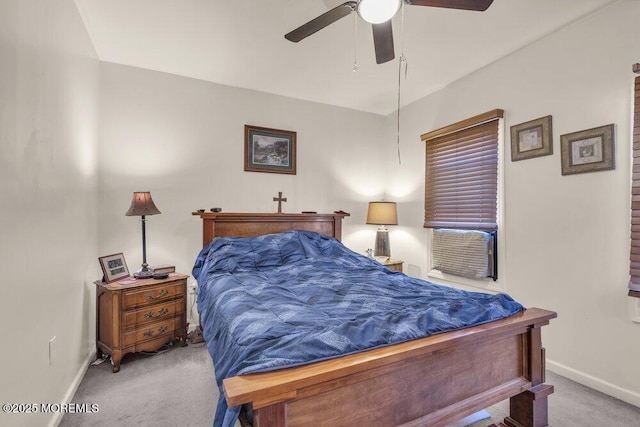 carpeted bedroom with a ceiling fan and baseboards