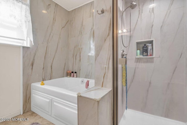 bathroom featuring tile walls, a marble finish shower, and a bath