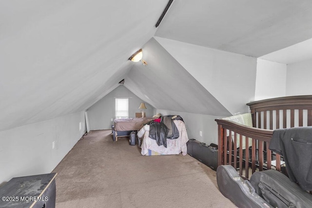 carpeted bedroom featuring vaulted ceiling