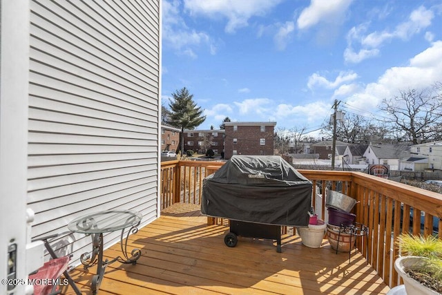 wooden deck featuring a residential view