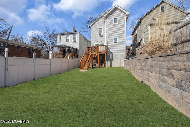 view of yard featuring stairs and a fenced backyard