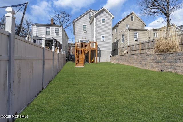 view of yard featuring fence private yard and stairway