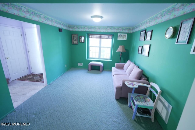 living area with carpet, tile patterned flooring, and visible vents