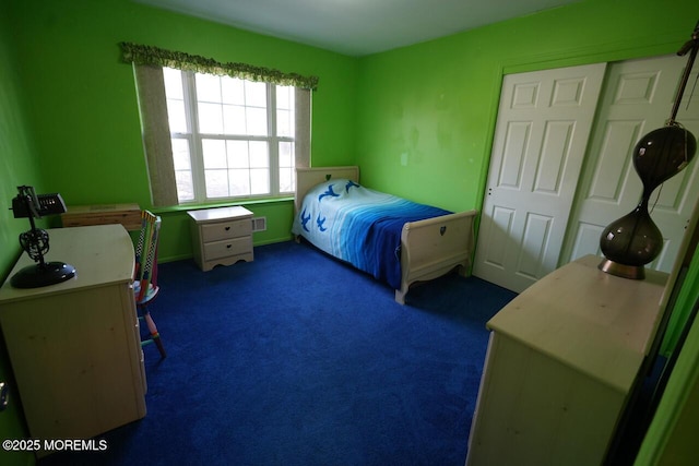 bedroom with dark colored carpet