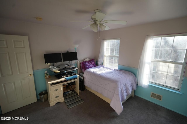 bedroom featuring carpet, visible vents, and a ceiling fan