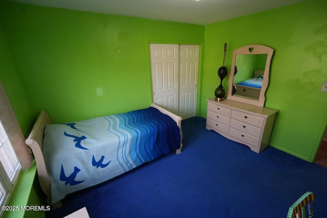 carpeted bedroom featuring a closet