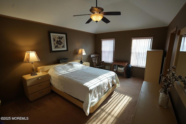 carpeted bedroom featuring vaulted ceiling and ceiling fan