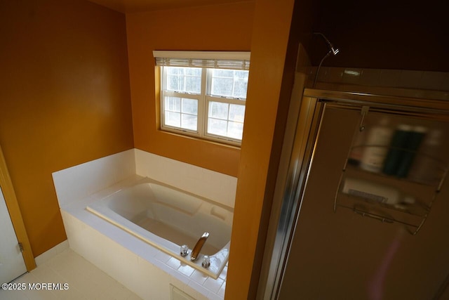 full bath featuring a garden tub and a shower with shower door