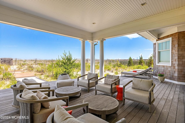 deck featuring fence and an outdoor living space