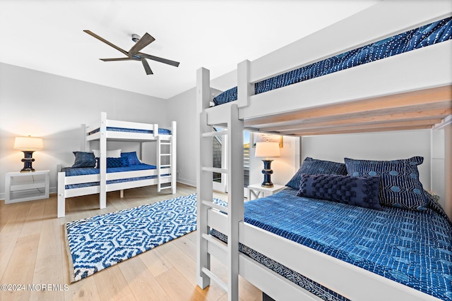 bedroom featuring a ceiling fan and wood finished floors