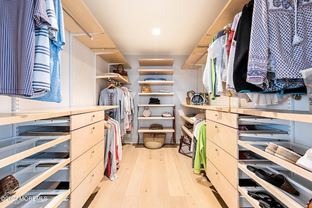 walk in closet featuring light wood-style floors