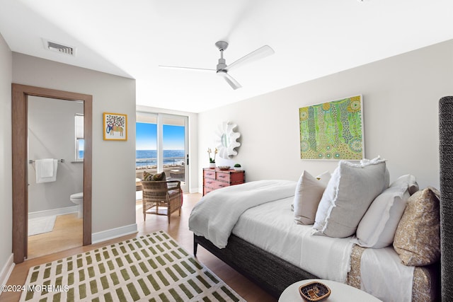 bedroom with connected bathroom, visible vents, baseboards, access to exterior, and light wood-type flooring