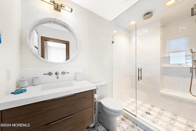 full bathroom with toilet, vanity, tile walls, backsplash, and a shower stall