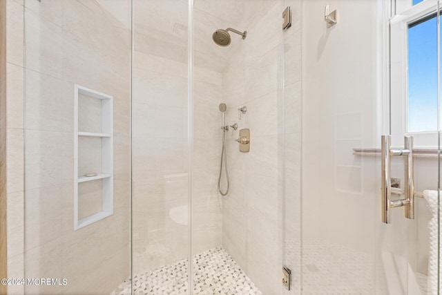 full bathroom featuring a shower stall