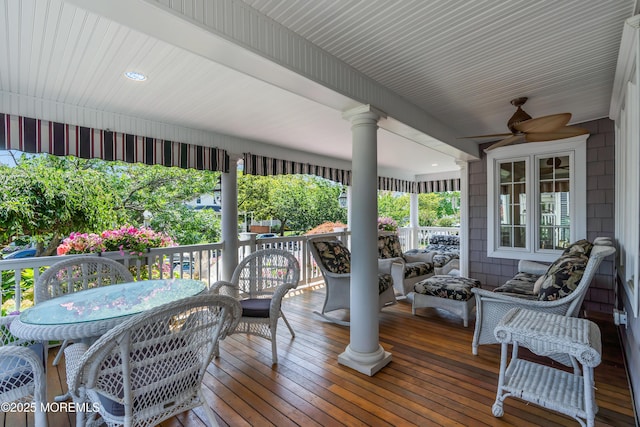 wooden deck with ceiling fan