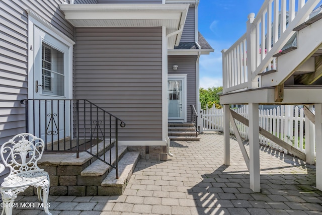 view of exterior entry with fence