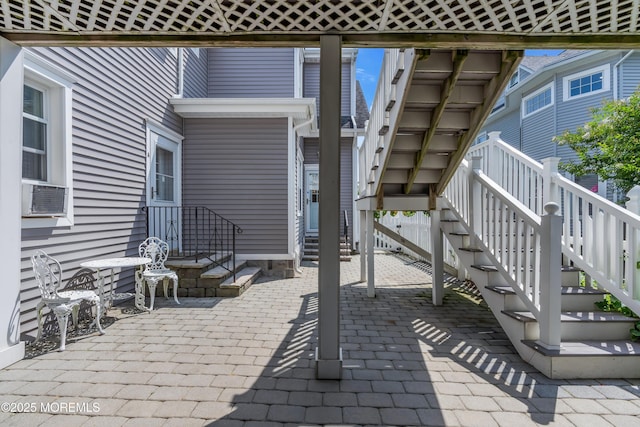 view of patio / terrace with cooling unit and entry steps