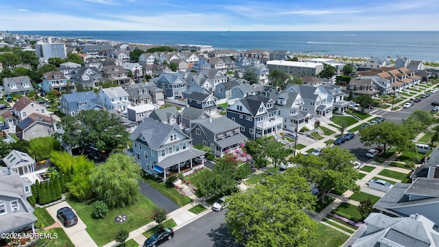 birds eye view of property featuring a residential view and a water view