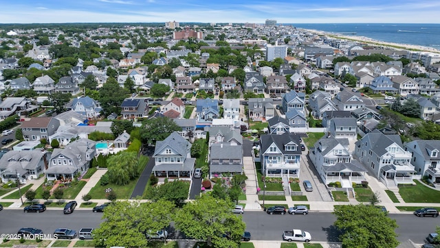 aerial view featuring a water view and a residential view