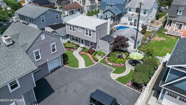 birds eye view of property with a residential view