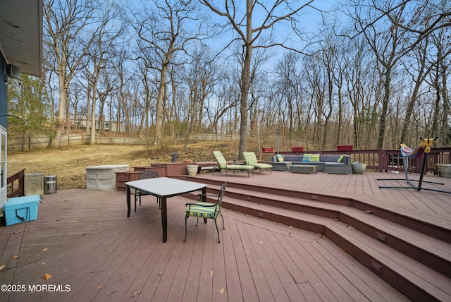 wooden terrace featuring fence