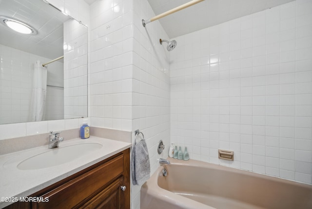 bathroom featuring vanity and shower / bathtub combination with curtain