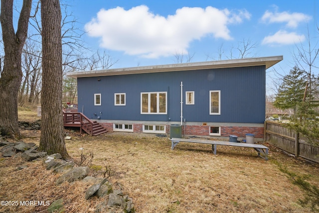 back of house featuring stairs, central AC unit, a wooden deck, and fence