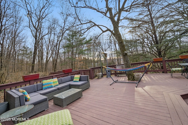 wooden deck with an outdoor hangout area and outdoor dining area