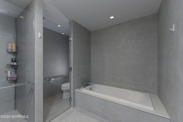 full bath featuring toilet, tile walls, a tile shower, a bath, and tile patterned floors