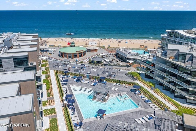 drone / aerial view with a water view and a view of the beach