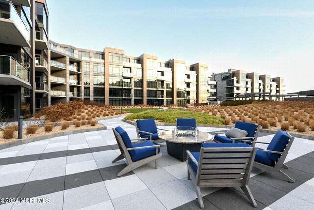 view of patio with a fire pit