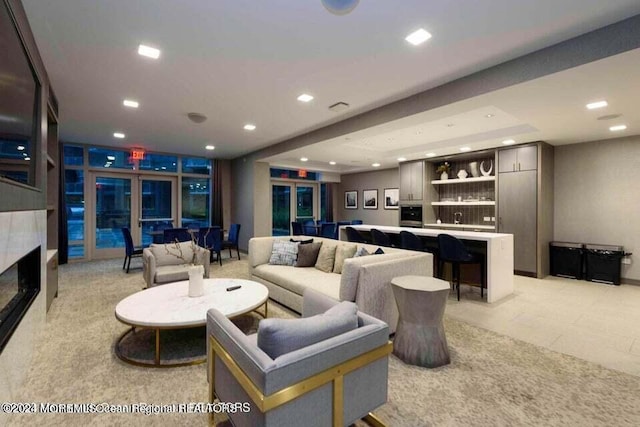 living area featuring a fireplace and recessed lighting