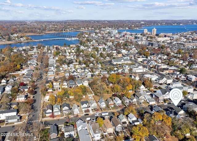 birds eye view of property featuring a residential view and a water view