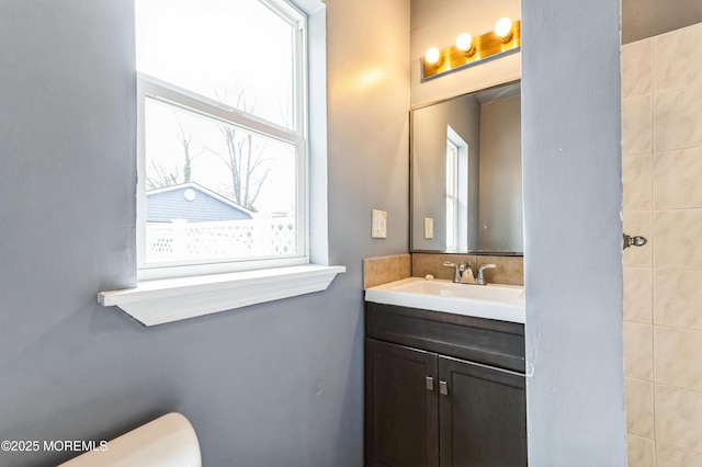 bathroom featuring vanity and toilet