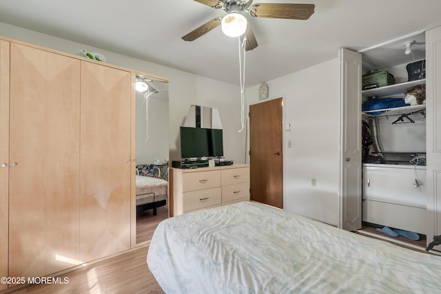 bedroom featuring wood finished floors and a ceiling fan